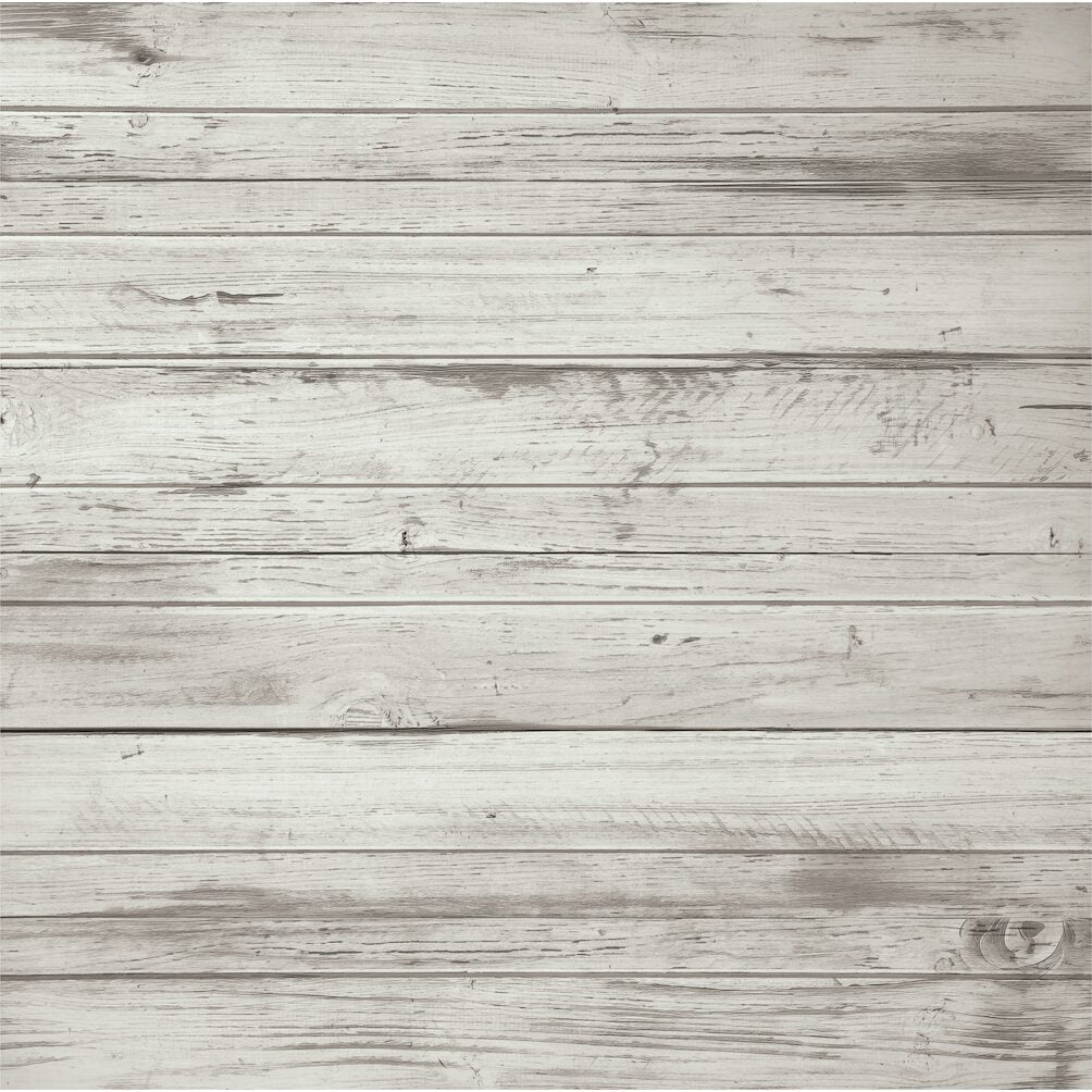 A close-up texture of horizontal whitewashed wooden planks with visible grain, knots, and weathered gray tones.